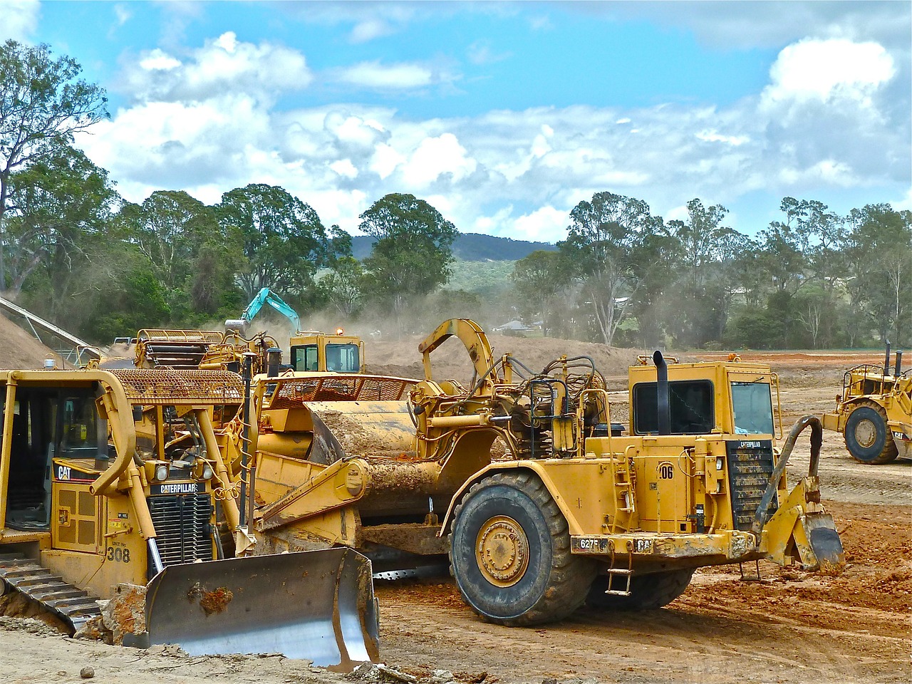 A Caterpillar bulldozer in forefront.

Image is in the public domain.